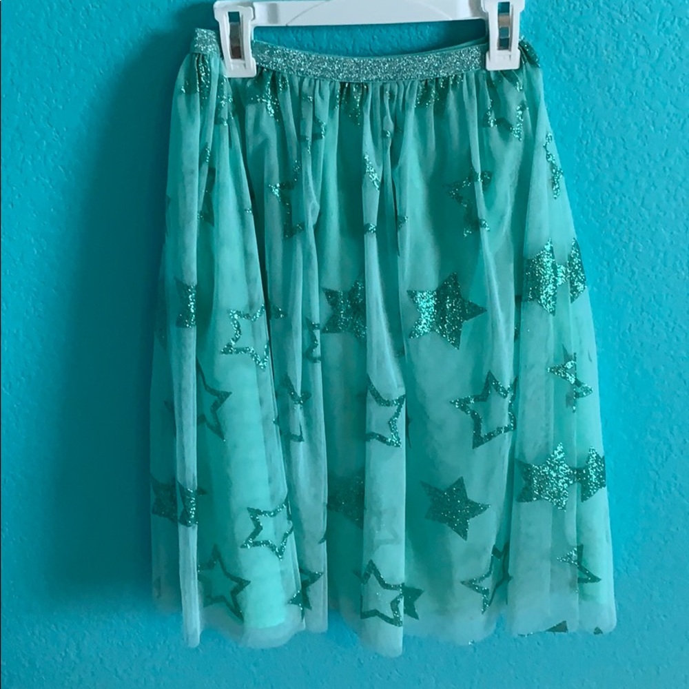 Gil’s long glitter skirt